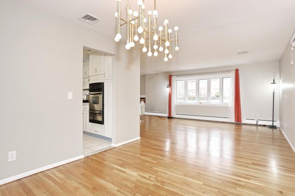 Empty room, Interior, Kitchen, Pendant Lights, Stainless Steel Appliances, Wood Texture Flooring