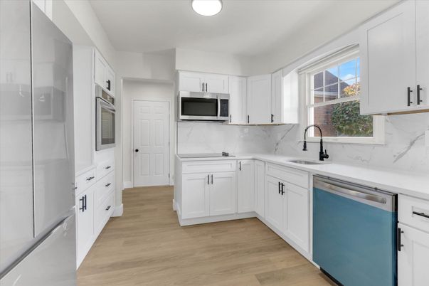 Interior, Kitchen, Marble Walls, Stainless Steel Appliances, Wood Texture Flooring
