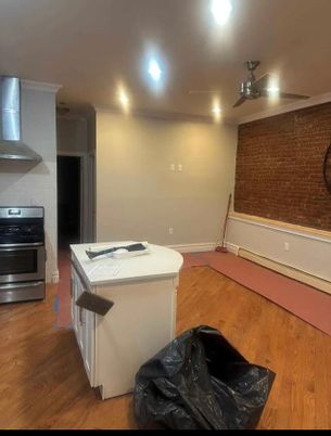 Interior, Kitchen, Recessed Lighting, Stainless Steel Appliances, Stone Walls, Wood Texture Flooring