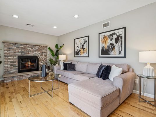 Fireplace, Interior, Living room, Recessed Lighting, Stone Walls, Wood Texture Flooring
