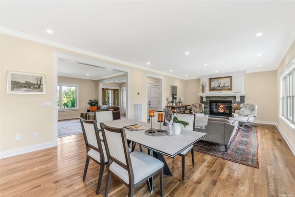 Dining room, Fireplace, Interior, Living room, Recessed Lighting, Wood Texture Flooring