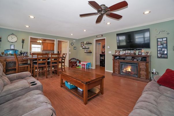 Dining room, Fireplace, Interior, Living room, Recessed Lighting, Wood Texture Flooring