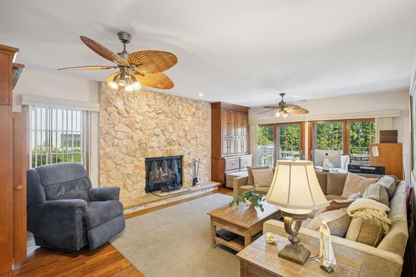 Fireplace, Interior, Living room, Recessed Lighting, Stone Walls, Wood Texture Flooring