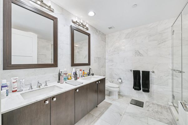 Bathroom, Dual Sink Vanities, Glass Shower, Interior, Marble, Marble Walls, Recessed Lighting