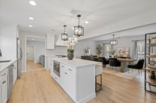 Dining room, Interior, Kitchen, Pendant Lights, Recessed Lighting, Stainless Steel Appliances, Wood Texture Flooring