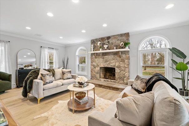 Fireplace, Interior, Living room, Recessed Lighting, Stone Walls, Wood Texture Flooring