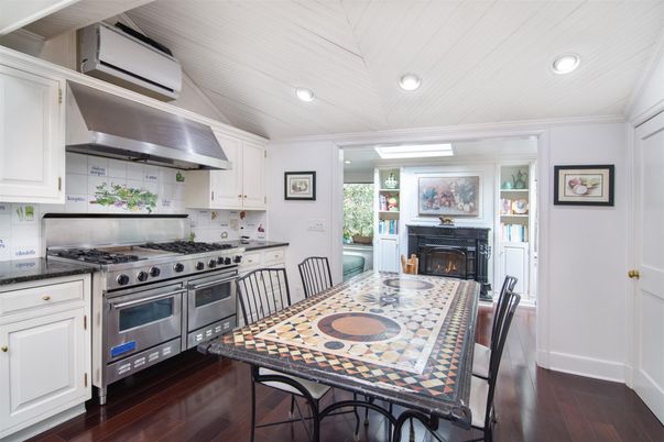 Dining room, Fireplace, Interior, Kitchen, Recessed Lighting, Stainless Steel Appliances, Wood Texture Flooring