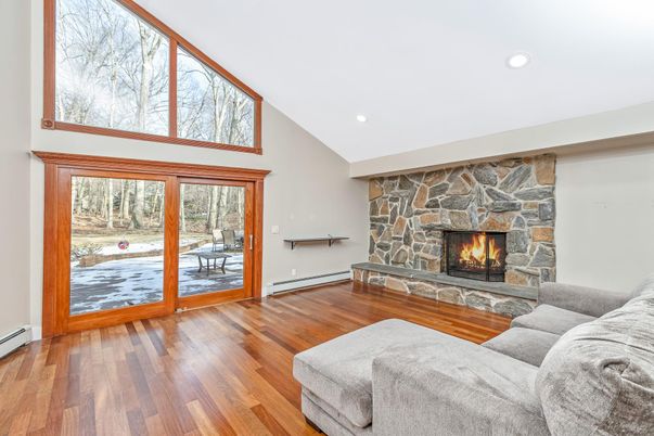 Fireplace, Interior, Living room, Recessed Lighting, Stone Walls, Wood Texture Flooring