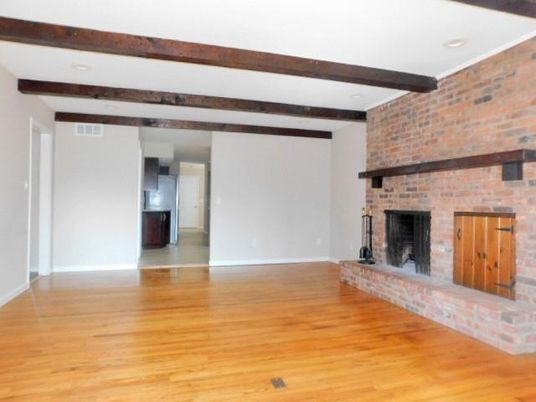 Empty room, Fireplace, Interior, Recessed Lighting, Stone Walls, Wooden Beams, Wood Texture Flooring