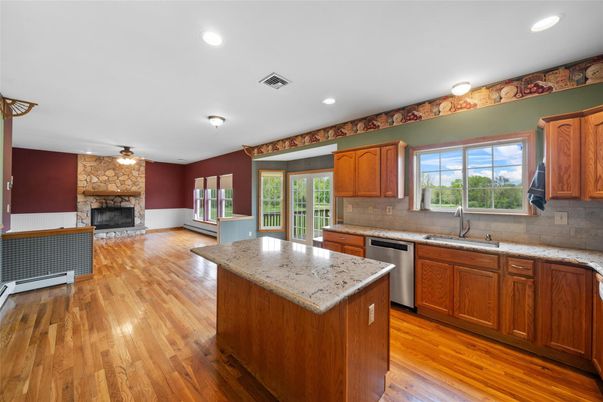 Fireplace, Interior, Kitchen, Recessed Lighting, Stone Walls, Wood Texture Flooring