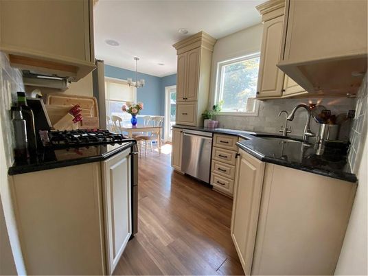Chandelier, Dining room, Interior, Kitchen, Pendant Lights, Recessed Lighting, Stainless Steel Appliances, Wood Texture Flooring