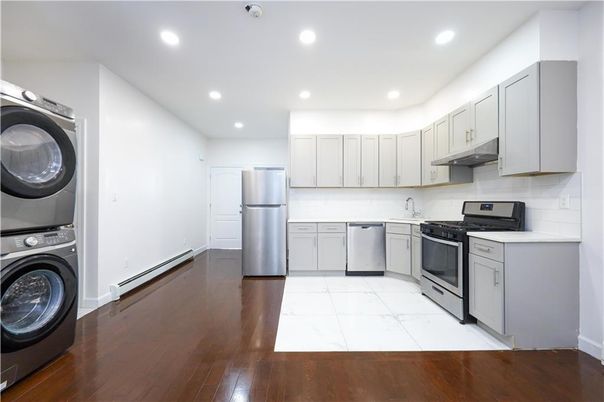 Interior, Kitchen, Marble, Recessed Lighting, Stainless Steel Appliances, Washer, Wood Texture Flooring