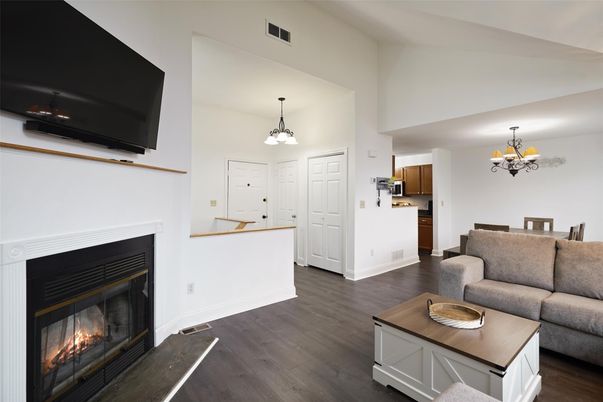 Chandelier, Dining room, Fireplace, Interior, Kitchen, Living room, Pendant Lights, Wood Texture Flooring