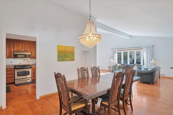 Chandelier, Dining room, Interior, Kitchen, Living room, Stainless Steel Appliances, Wood Texture Flooring