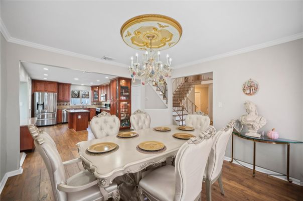 Chandelier, Dining room, Interior, Kitchen, Recessed Lighting, Stainless Steel Appliances, Wood Texture Flooring
