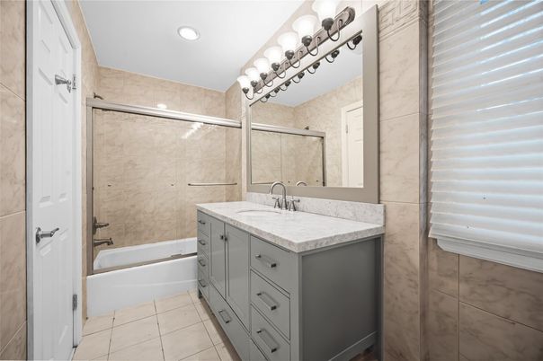 Bathroom, Dual Sink Vanities, Glass Shower, Interior, Marble Walls, Recessed Lighting