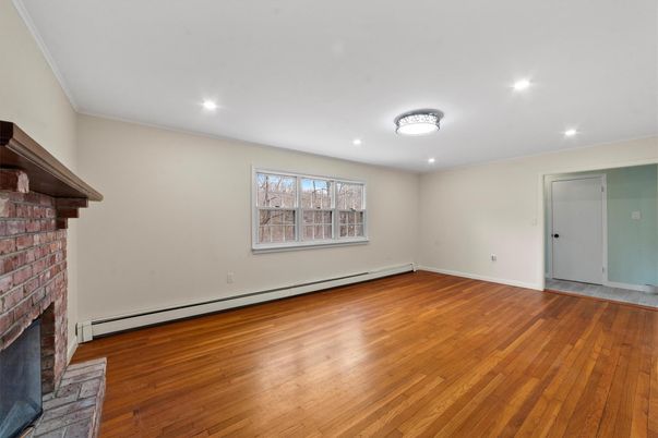 Empty room, Fireplace, Interior, Recessed Lighting, Stone Walls, Wood Texture Flooring
