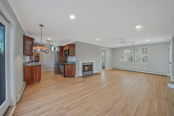 Empty room, Fireplace, Interior, Pendant Lights, Recessed Lighting, Wood Texture Flooring