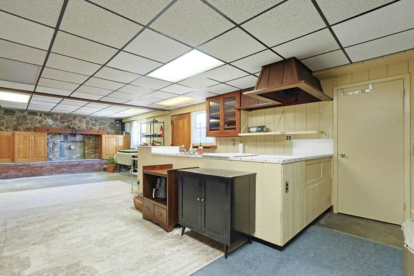 Fireplace, Interior, Kitchen, Recessed Lighting, Stone Walls, Tile Countertops