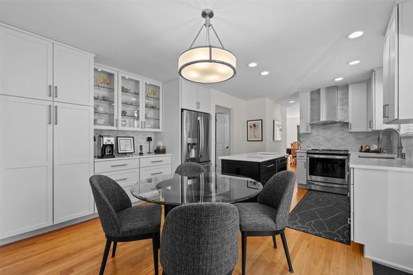 Dining room, Interior, Kitchen, Pendant Lights, Recessed Lighting, Stainless Steel Appliances, Wood Texture Flooring