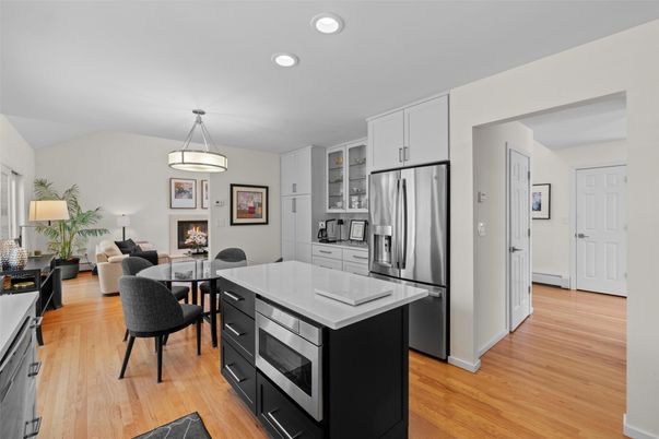 Dining room, Fireplace, Interior, Kitchen, Living room, Pendant Lights, Recessed Lighting, Stainless Steel Appliances, Wood Texture Flooring