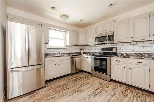 Interior, Kitchen, Recessed Lighting, Stainless Steel Appliances, Wood Texture Flooring