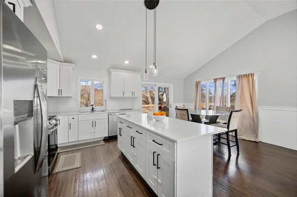 Dining room, Interior, Kitchen, Pendant Lights, Recessed Lighting, Stainless Steel Appliances, Wood Texture Flooring