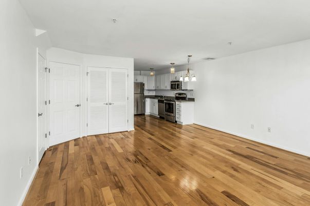 Empty room, Interior, Kitchen, Pendant Lights, Stainless Steel Appliances, Wood Texture Flooring