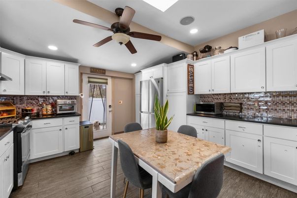 Dining room, Interior, Kitchen, Recessed Lighting, Stainless Steel Appliances, Wood Texture Flooring