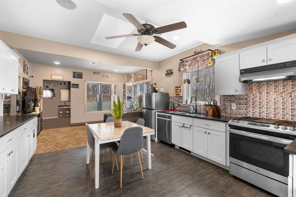 Dining room, Interior, Kitchen, Recessed Lighting, Stainless Steel Appliances, Wood Texture Flooring