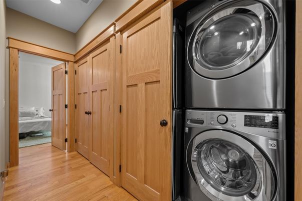 Bedroom, Interior, Recessed Lighting, Utility Closets, Washer, Wood Texture Flooring