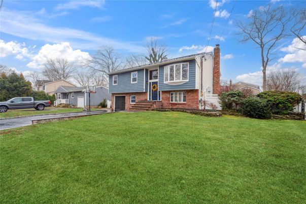 Attached, Backyard, Exterior, Facade, Brick Facade, Raised Ranch