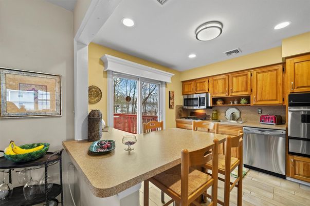 Dining room, Interior, Kitchen, Recessed Lighting, Stainless Steel Appliances, Wood Texture Flooring