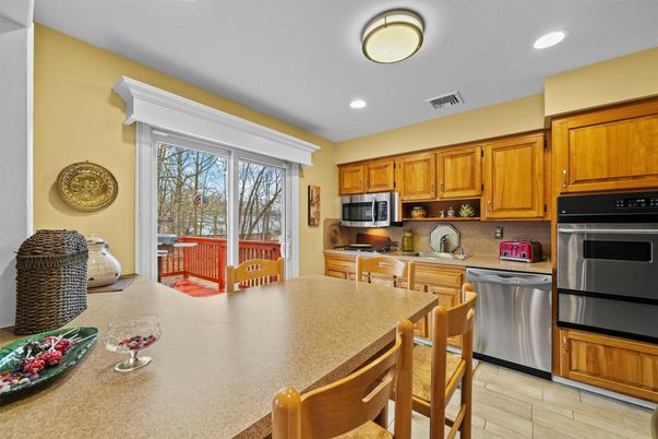 Dining room, Interior, Kitchen, Recessed Lighting, Stainless Steel Appliances, Wood Texture Flooring