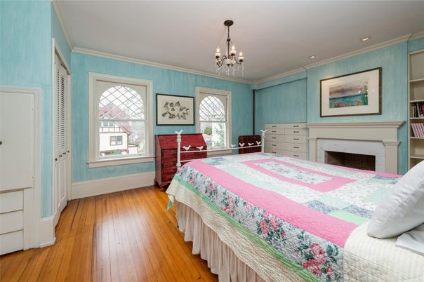 Bedroom, Chandelier, Fireplace, Interior, Recessed Lighting, Wood Texture Flooring