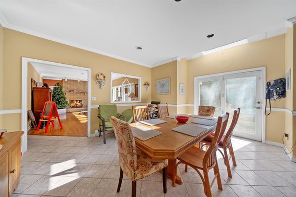 Dining room, Fireplace, Interior, Living room, Recessed Lighting, Wood Texture Flooring
