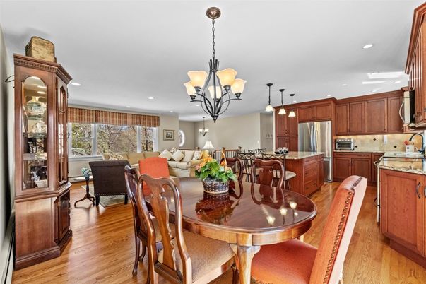 Chandelier, Dining room, Interior, Kitchen, Living room, Pendant Lights, Recessed Lighting, Stainless Steel Appliances, Wood Texture Flooring