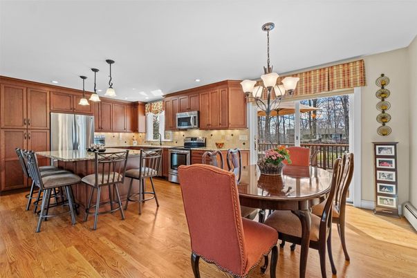 Chandelier, Dining room, Interior, Kitchen, Pendant Lights, Recessed Lighting, Stainless Steel Appliances, Wood Texture Flooring