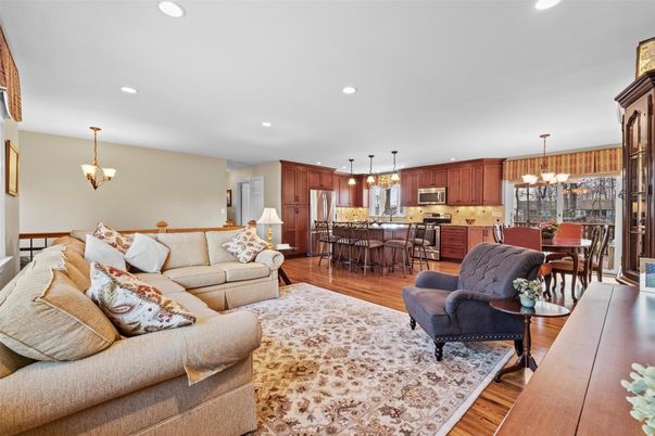 Chandelier, Dining room, Interior, Kitchen, Living room, Pendant Lights, Recessed Lighting, Stainless Steel Appliances, Wood Texture Flooring