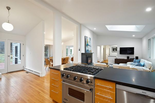 Fireplace, Interior, Kitchen, Living room, Pendant Lights, Recessed Lighting, Stainless Steel Appliances, Wood Texture Flooring