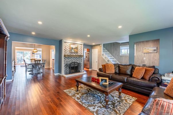 Dining room, Fireplace, Interior, Living room, Pendant Lights, Recessed Lighting, Wood Texture Flooring