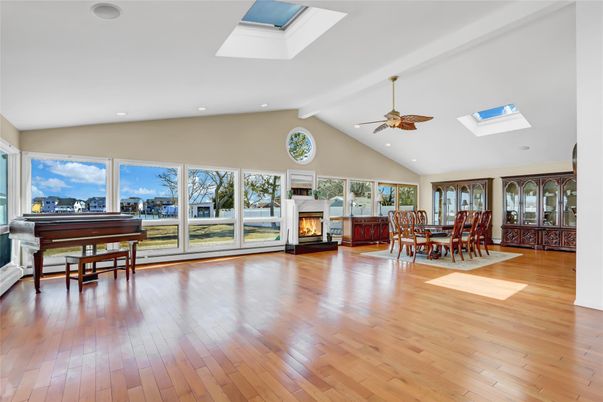 Dining room, Fireplace, Interior, Piano, Recessed Lighting, Wood Texture Flooring