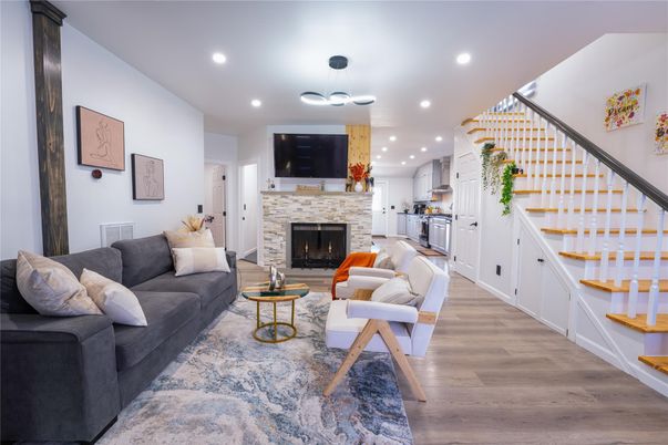 Fireplace, Interior, Kitchen, Living room, Pendant Lights, Recessed Lighting, Stainless Steel Appliances, Wood Texture Flooring