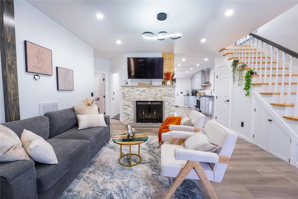 Fireplace, Interior, Kitchen, Living room, Pendant Lights, Recessed Lighting, Stainless Steel Appliances, Wood Texture Flooring