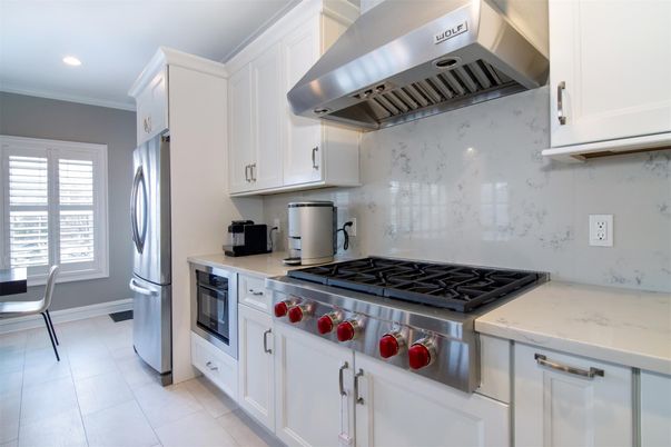 Interior, Kitchen, Marble Walls, Recessed Lighting, Stainless Steel Appliances