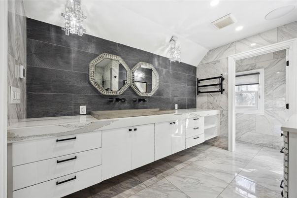 Bathroom, Dual Sink Vanities, Interior, Marble, Marble Walls, Pendant Lights, Recessed Lighting