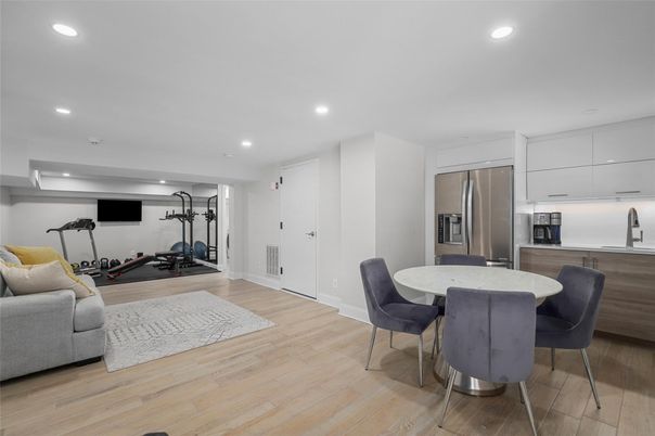 Dining room, Fitness Equipment, Interior, Kitchen, Recessed Lighting, Stainless Steel Appliances, Wood Texture Flooring