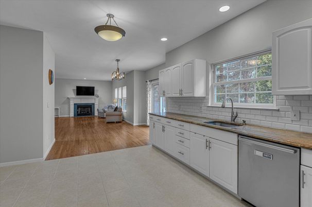 Chandelier, Fireplace, Interior, Kitchen, Living room, Pendant Lights, Recessed Lighting, Wood Texture Flooring