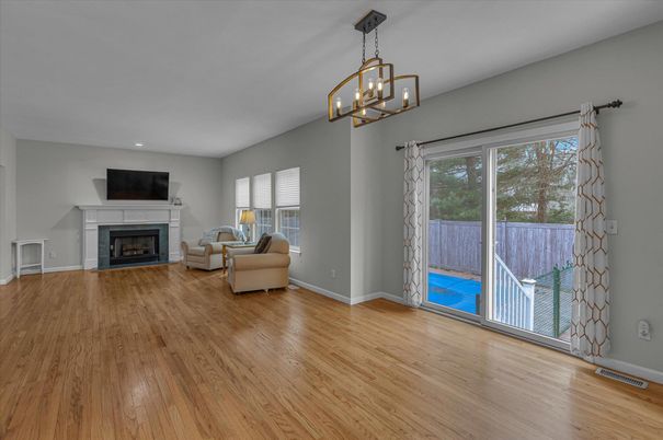 Empty room, Fireplace, Interior, Living room, Pendant Lights, Recessed Lighting, Wood Texture Flooring