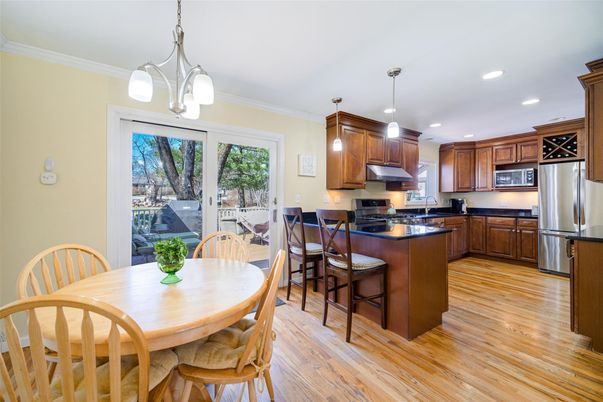 Dining room, Interior, Kitchen, Pendant Lights, Recessed Lighting, Stainless Steel Appliances, Wood Texture Flooring
